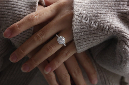 Woman wearing moissanite Solitaire rings in natural light