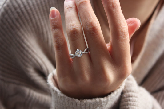Moissanite engagement ring worn on hand, minimalist everyday style