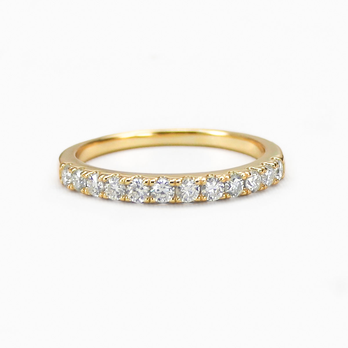 Aeris micro pavé moissanite band in 18K gold plated sterling silver on white background