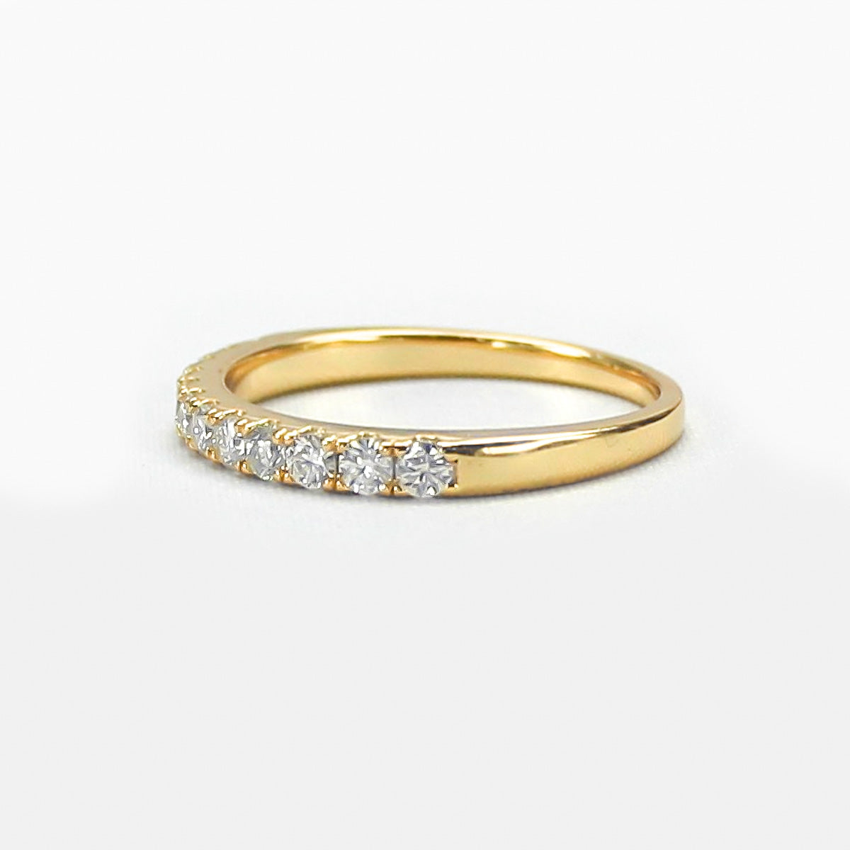 Aeris micro pavé moissanite band gold plated angled view