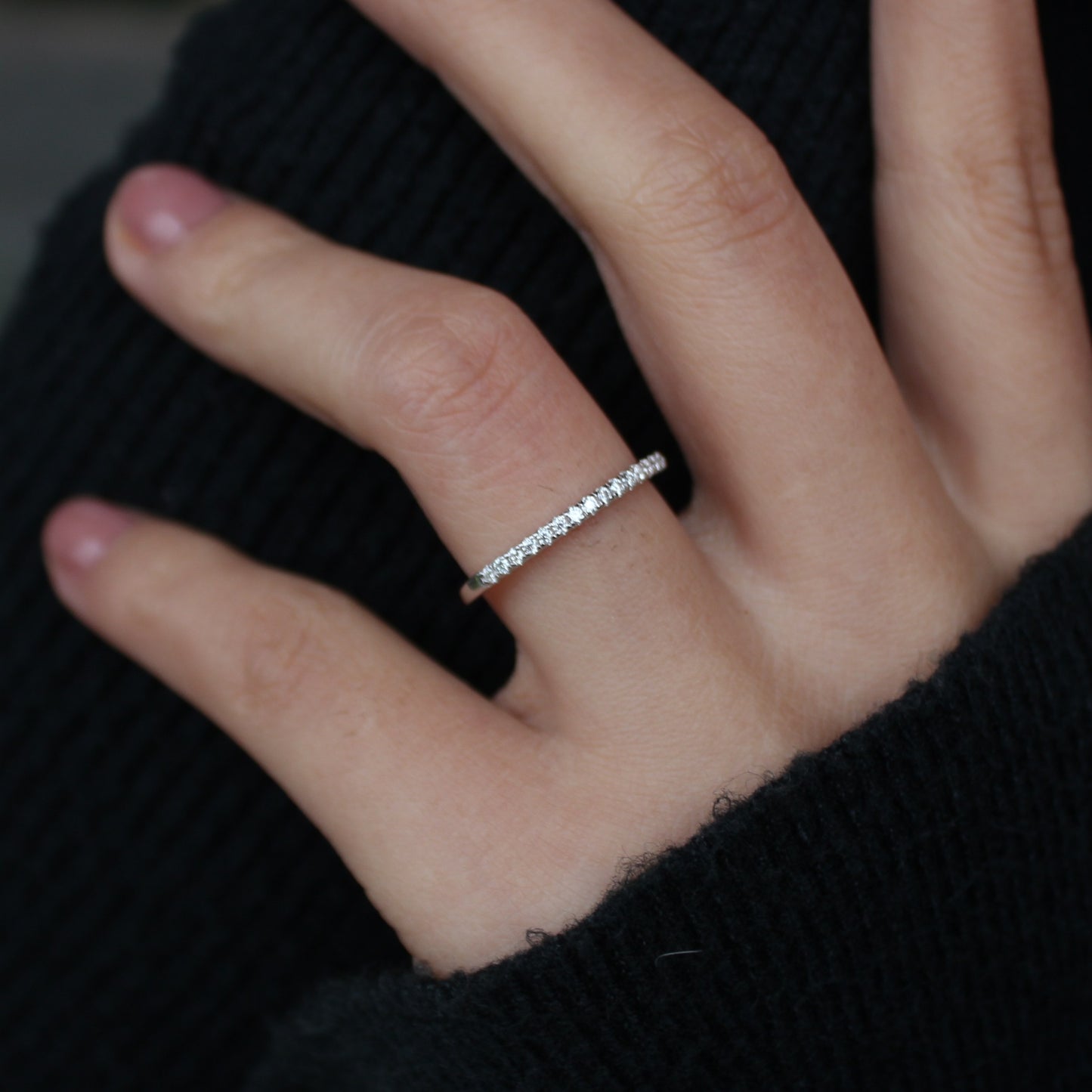 Aeris micro pavé moissanite band worn on hand, stacked look