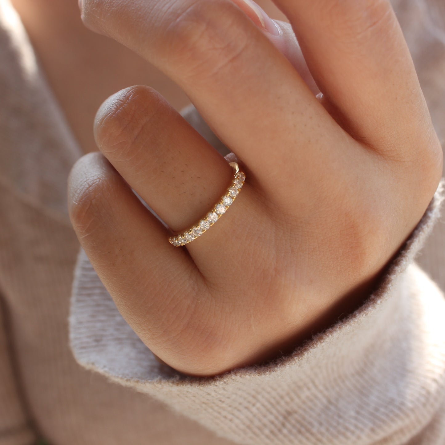 Aeris moissanite band worn on hand, minimal styling