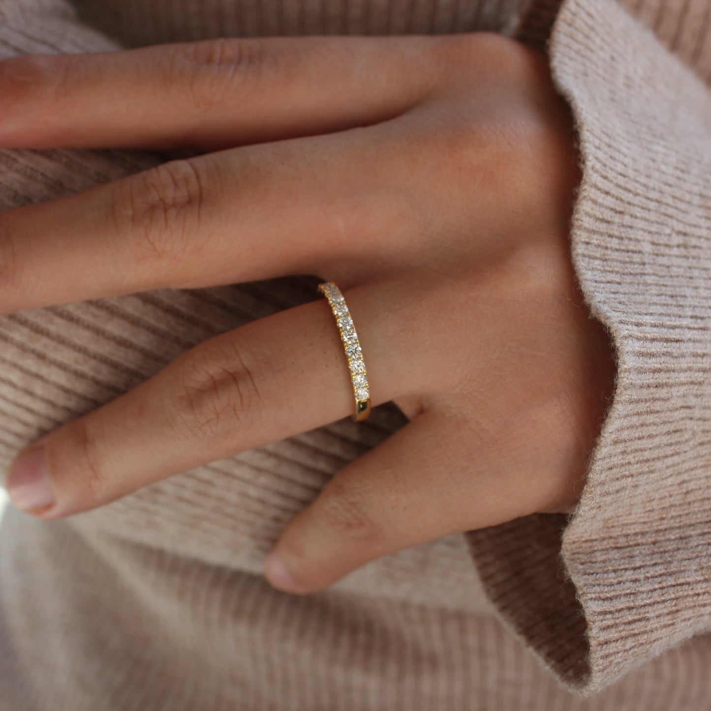 Moissanite pavé band worn on hand, gold plated
