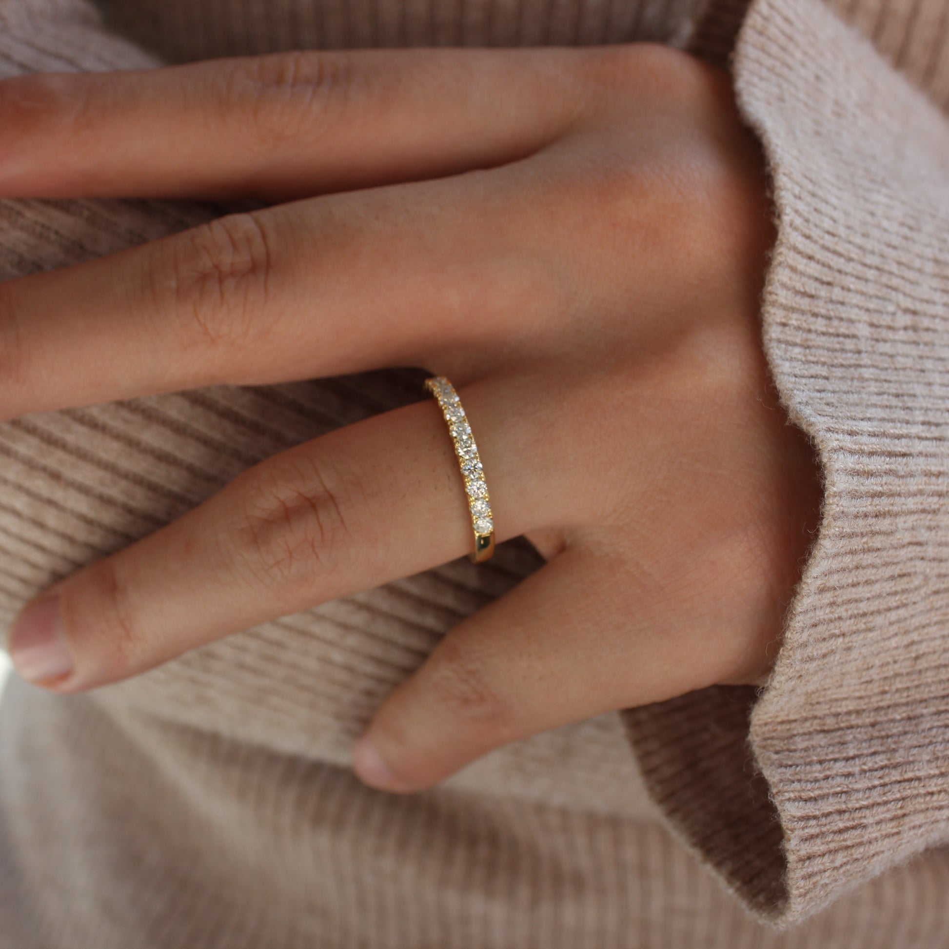 Moissanite pavé band worn on hand, gold plated