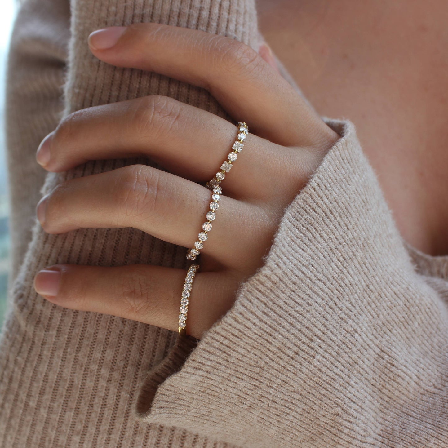 Close-up of alternating moissanite band styled with minimal hand pose