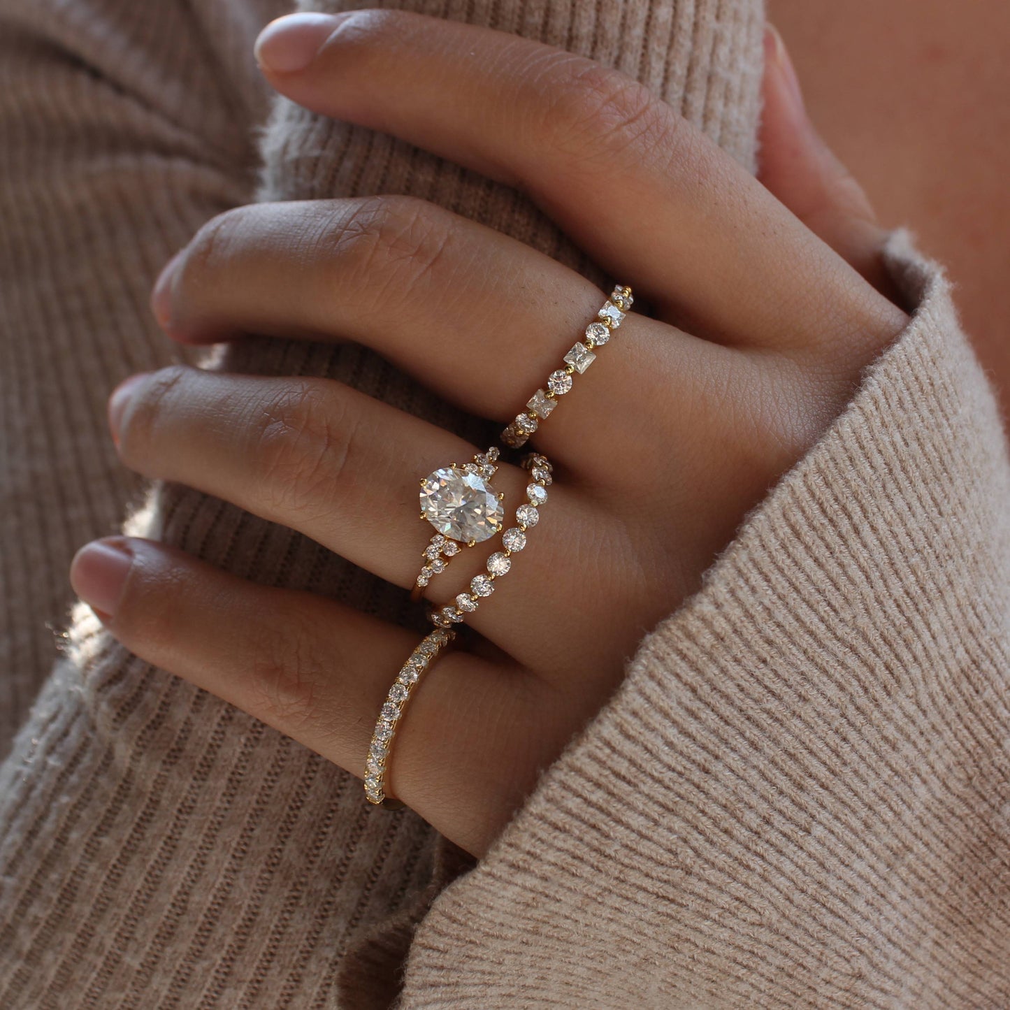 Stacked look featuring alternating moissanite eternity band on hand