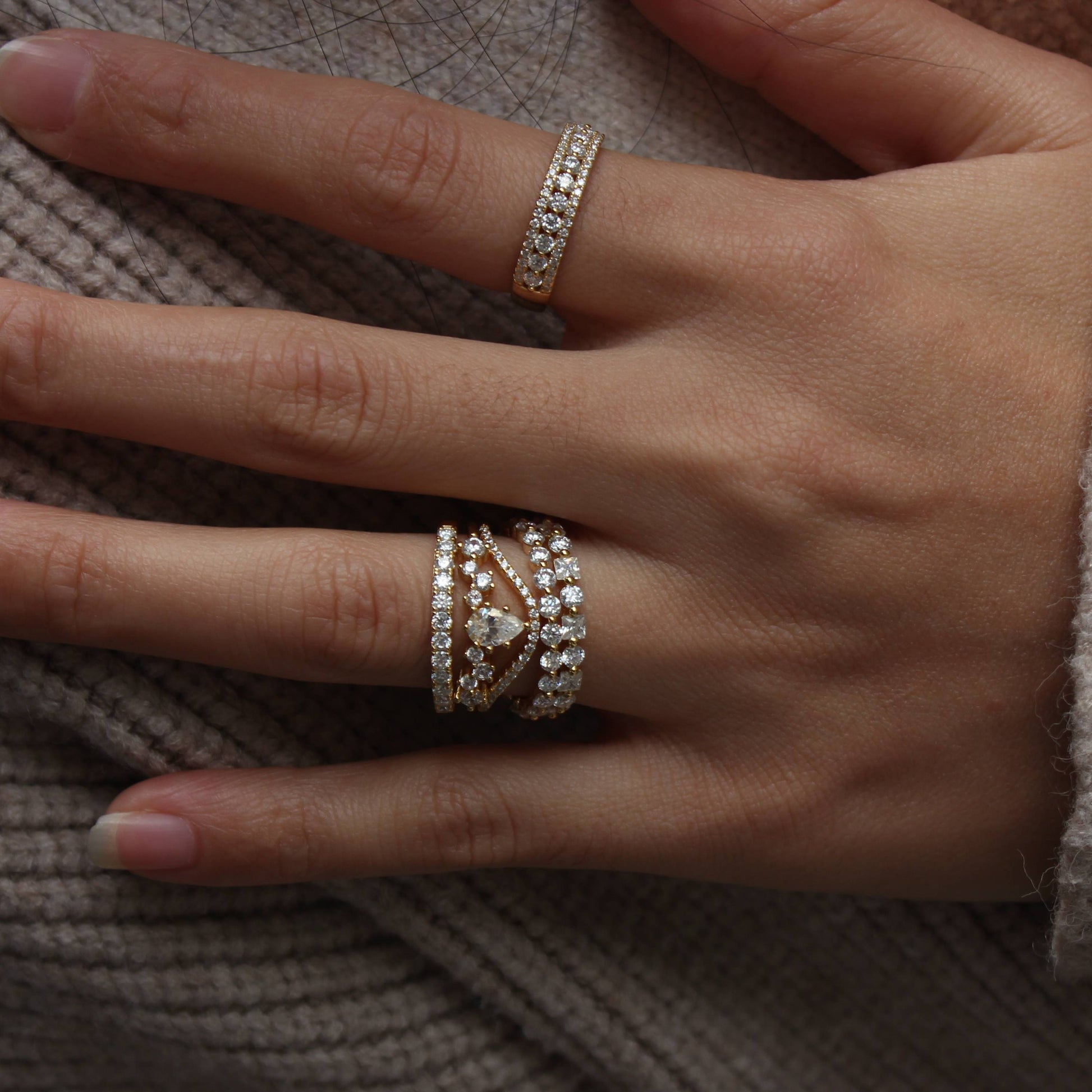 Everyday styling of alternating moissanite band worn with cozy knit outfit