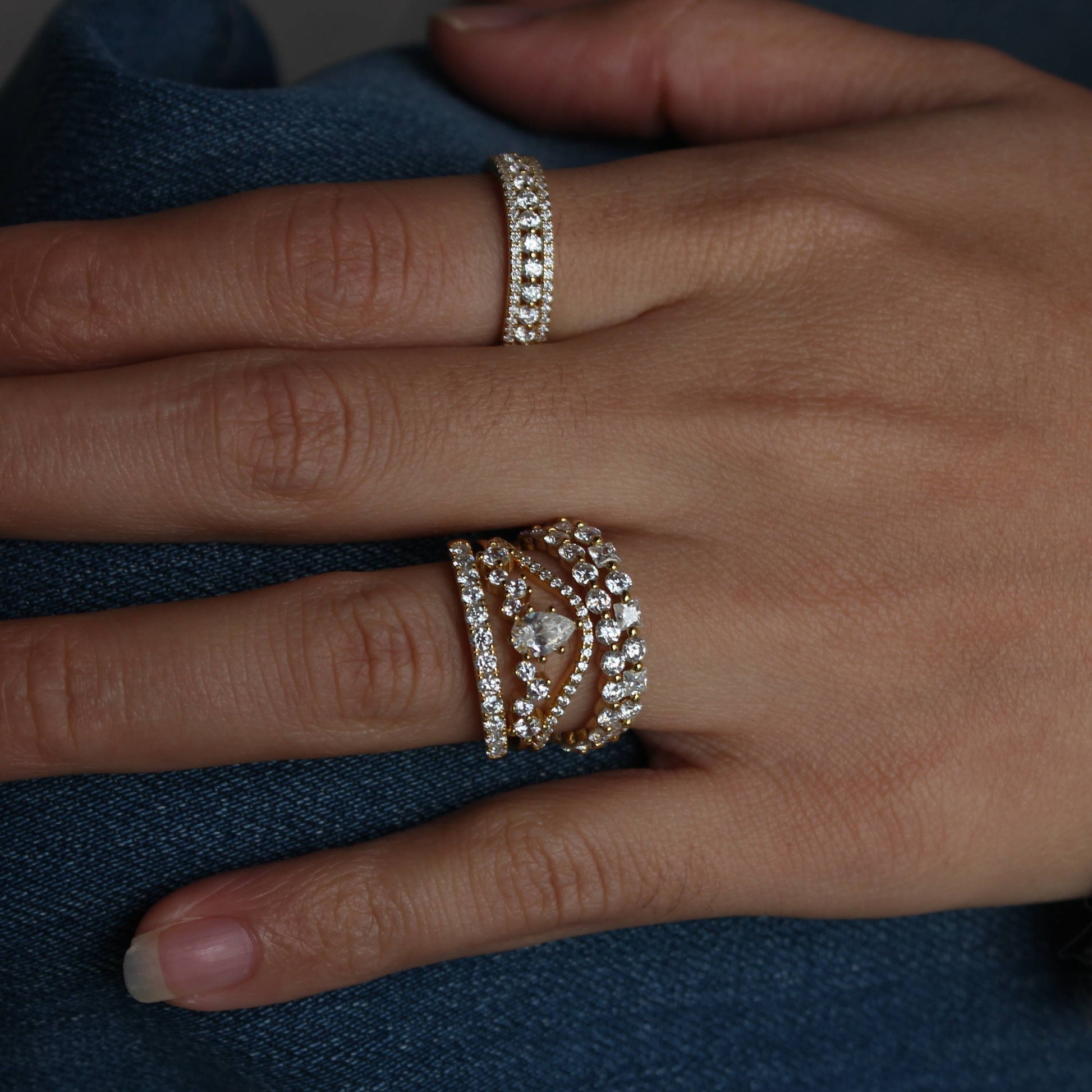Detailed sparkle of alternating moissanite eternity band while worn