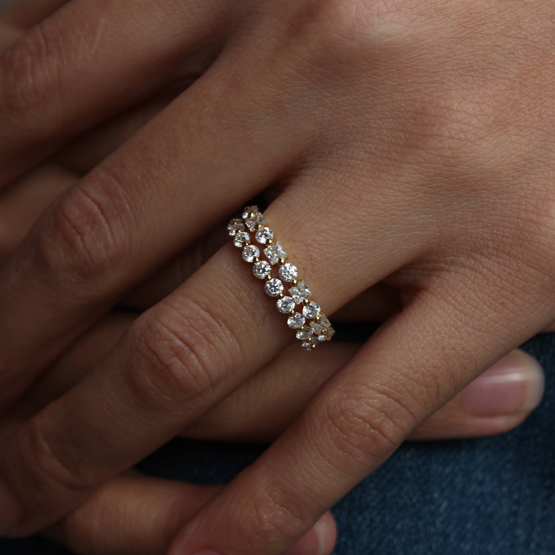 Minimal hand photo showcasing alternating moissanite band