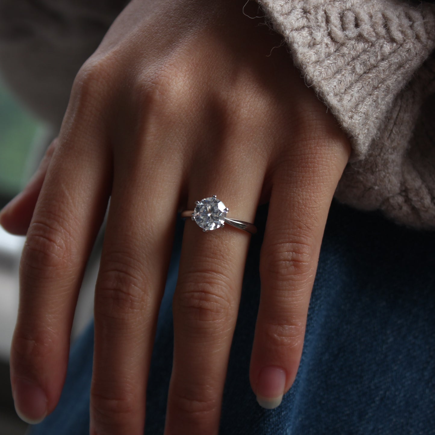 aurelia moissanite ring lifestyle hand photo
