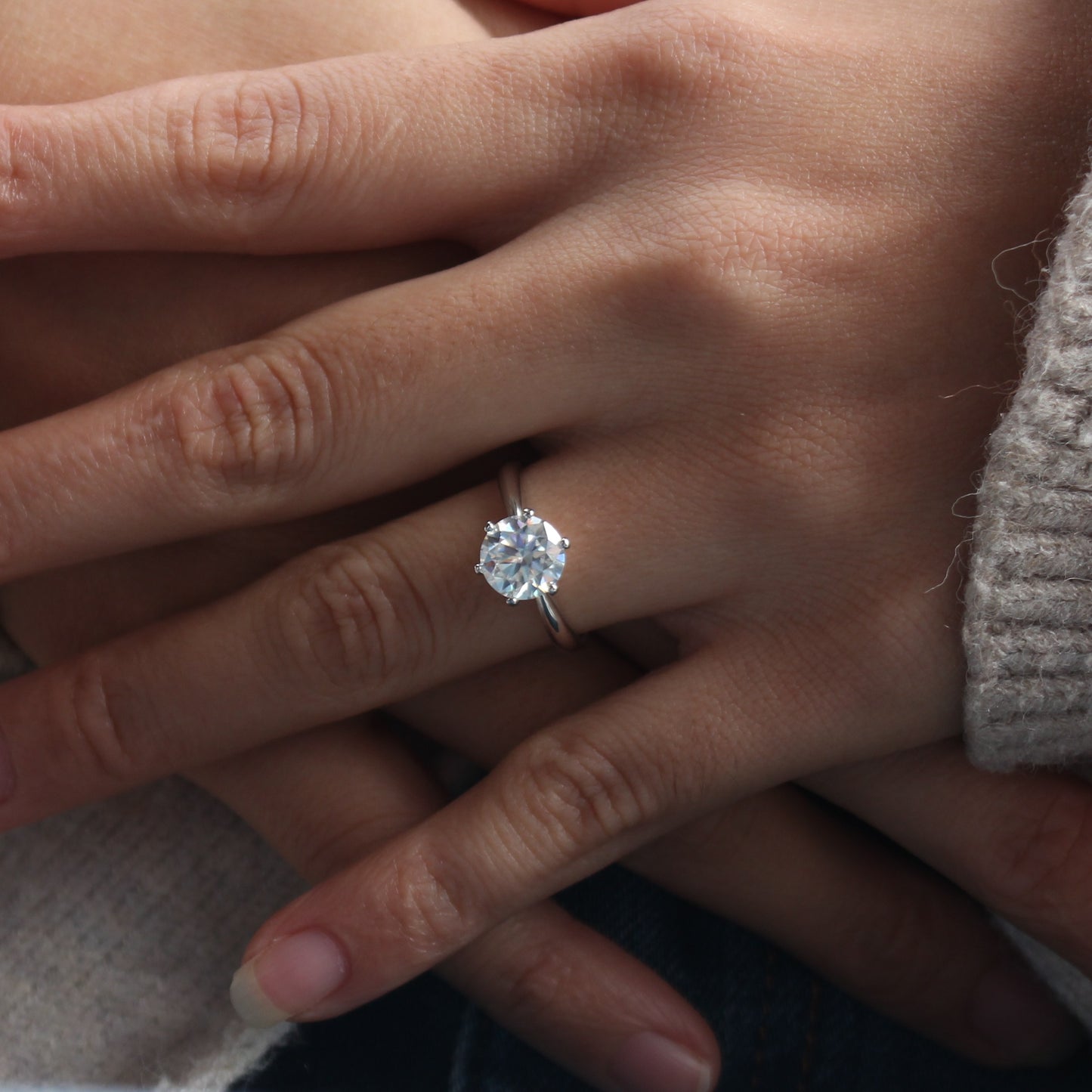 aurelia moissanite ring minimal style on female hand
