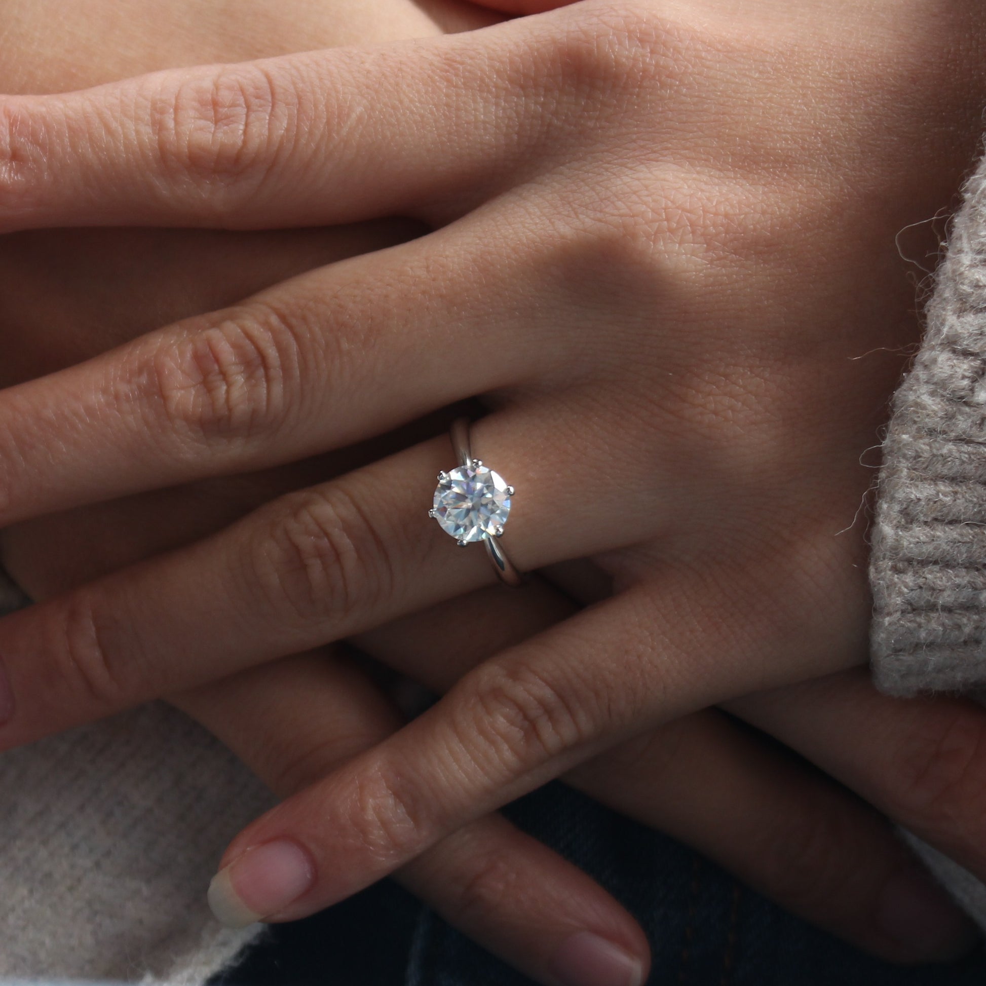 aurelia moissanite ring minimal style on female hand
