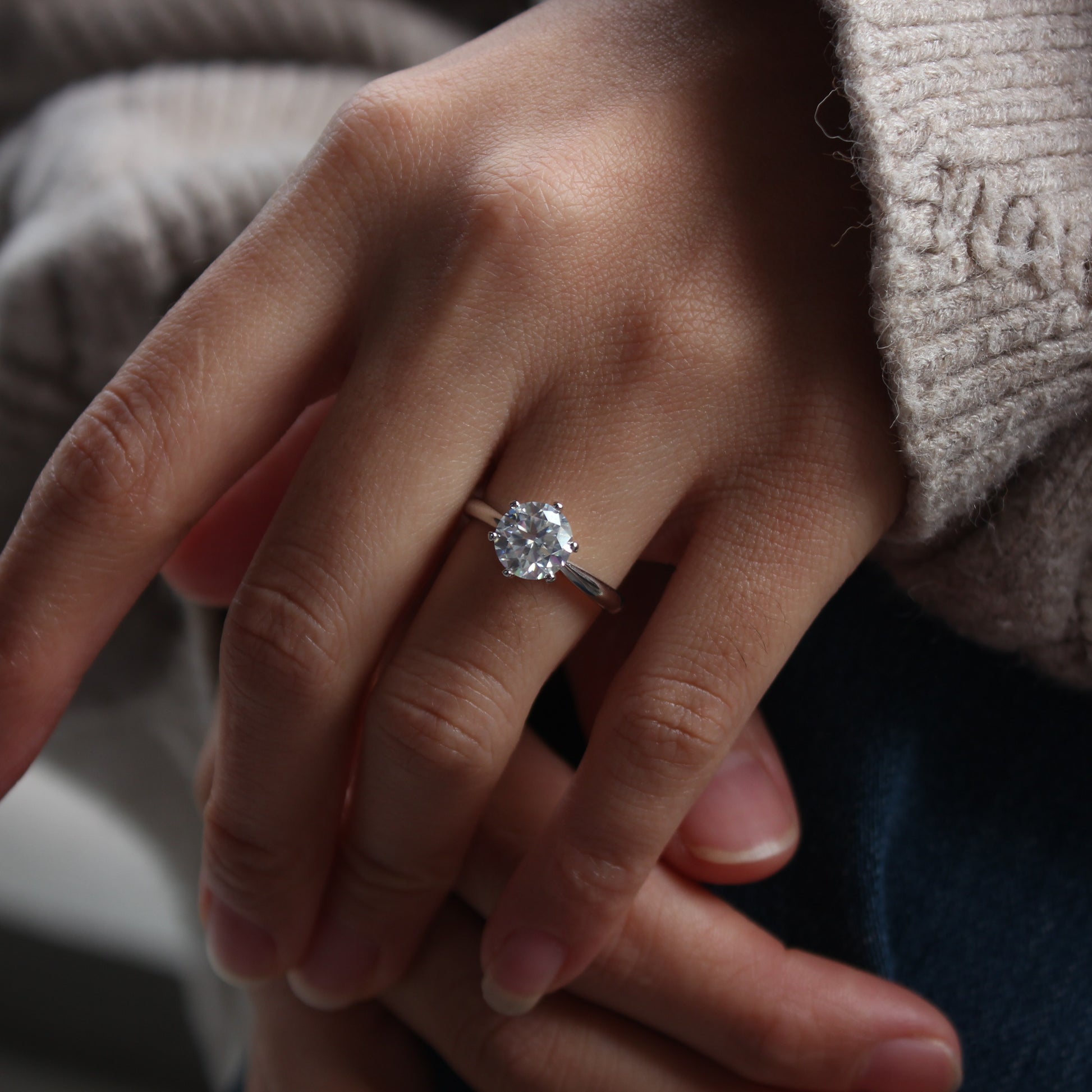 aurelia moissanite ring worn on hand natural daylight
