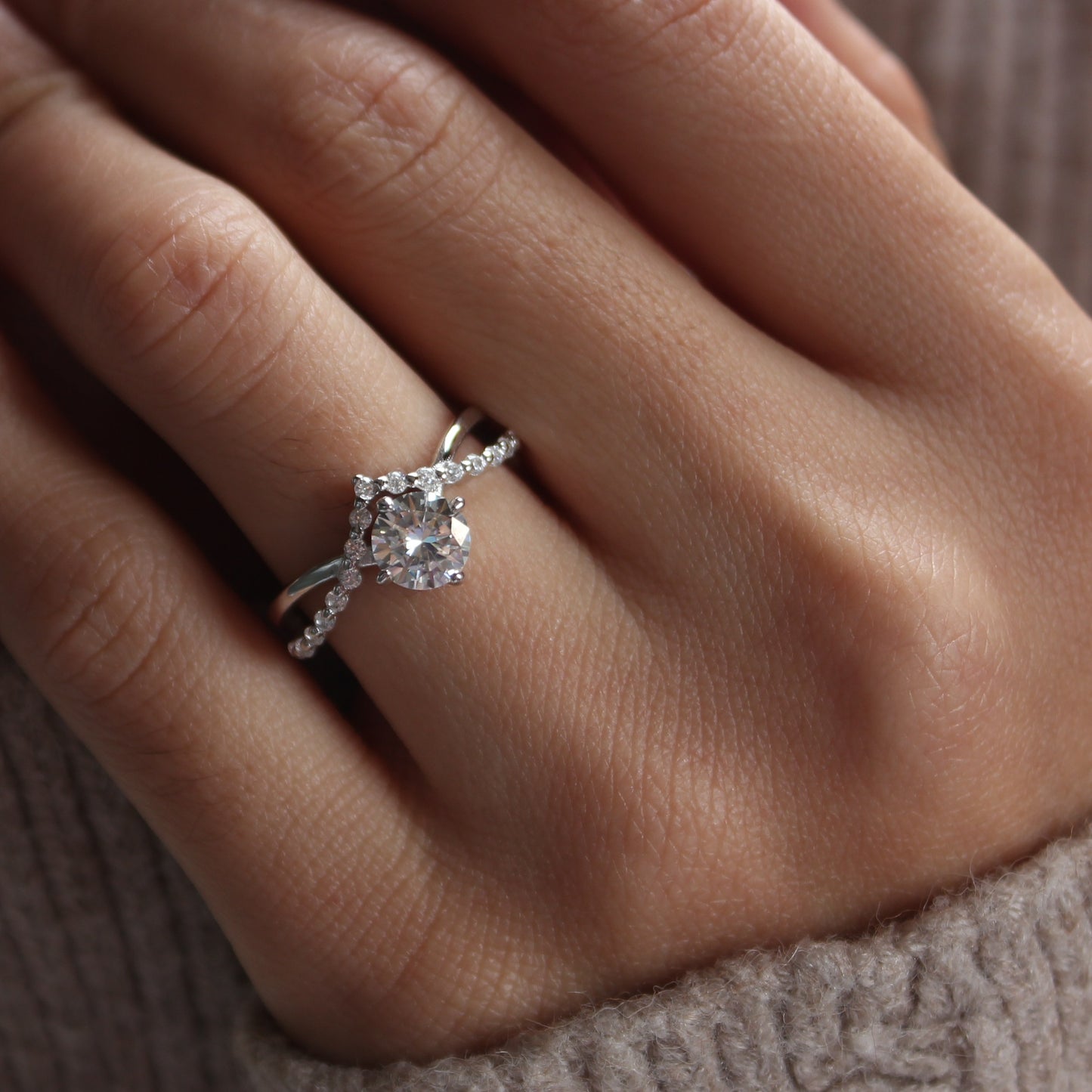 Auriel moissanite ring styled on hand, white gold tone for everyday wear