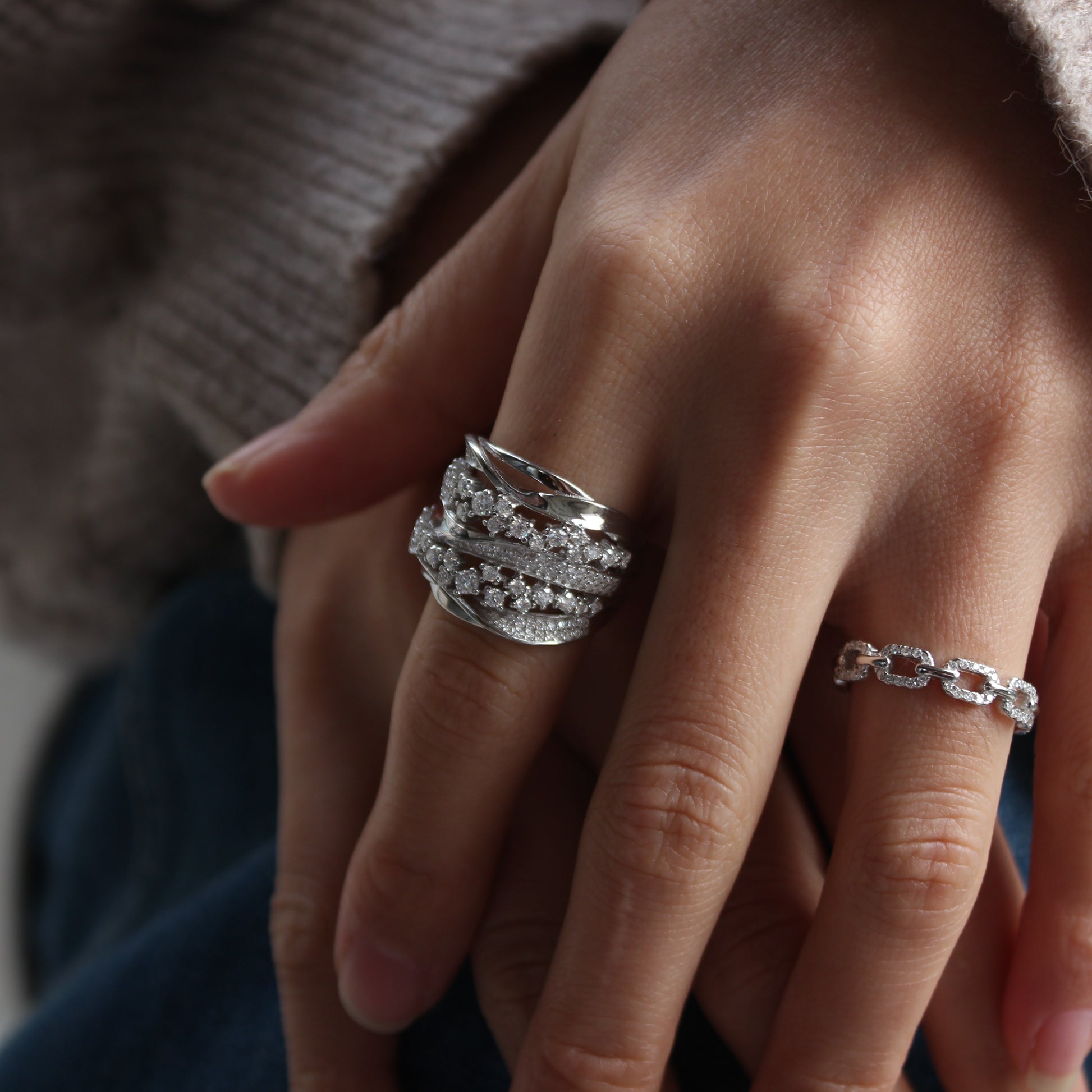 Minimalist styling of Aurora pavé band ring on hand