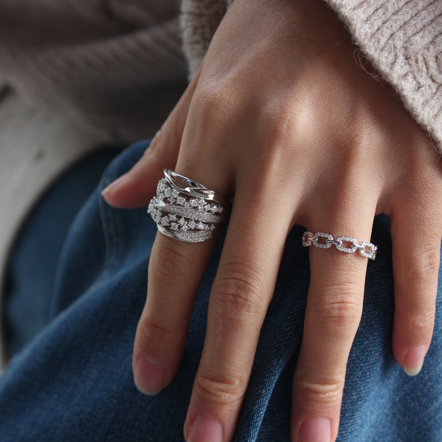 Close-up of Aurora pavé moissanite ring worn on finger, refined everyday look