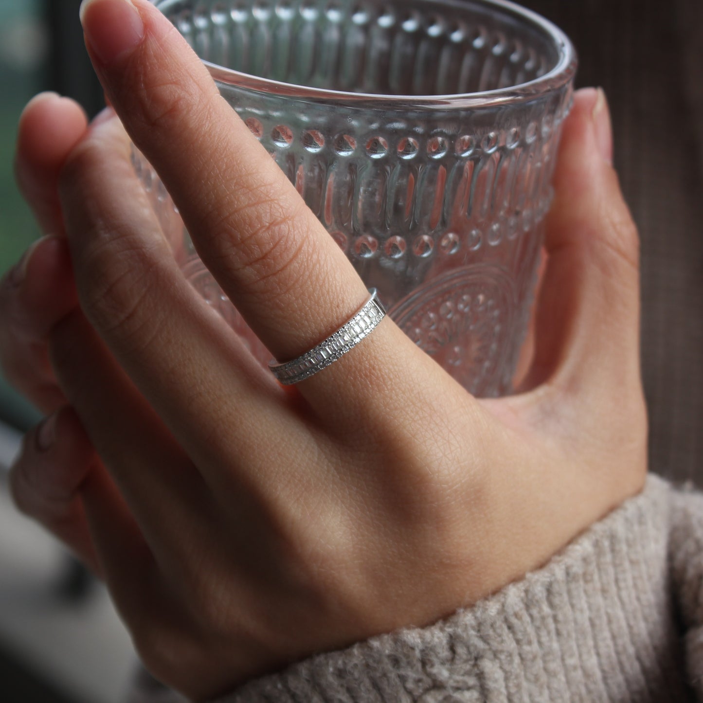 Baguette pavé moissanite band ring styled on hand, white gold tone stacking look