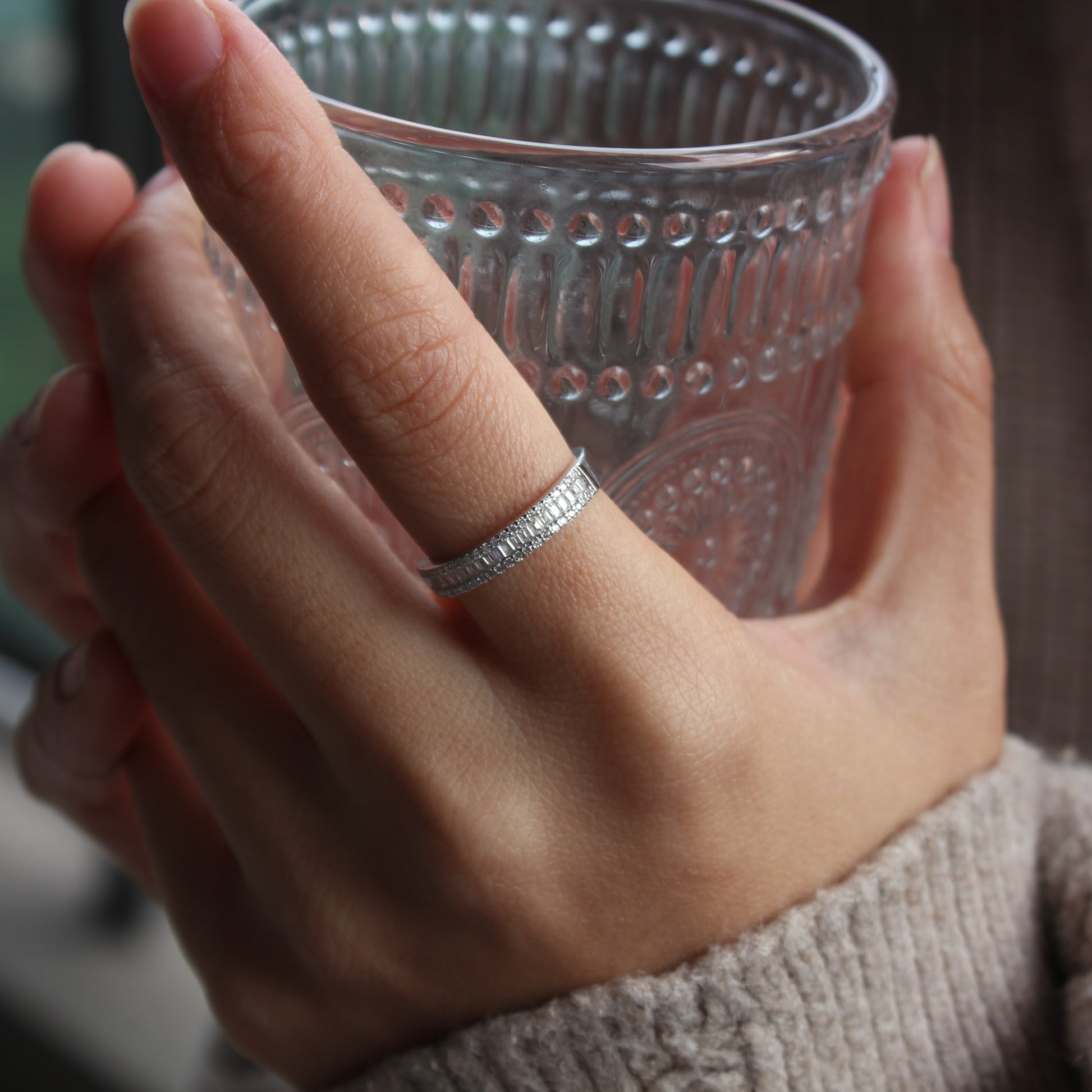 Baguette pavé moissanite band ring styled on hand, white gold tone stacking look