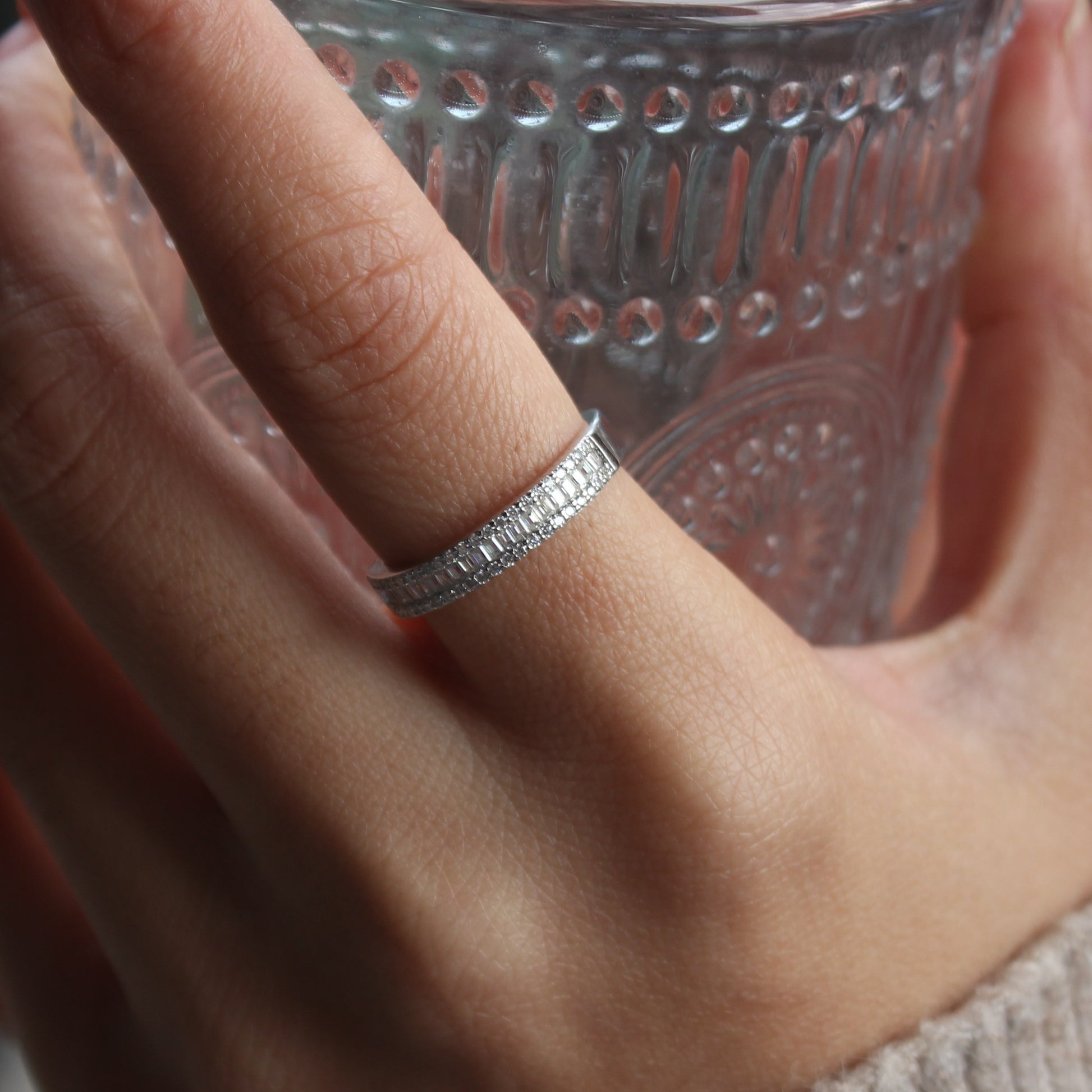 Baguette pavé moissanite band ring styled on hand, white gold tone for everyday wear