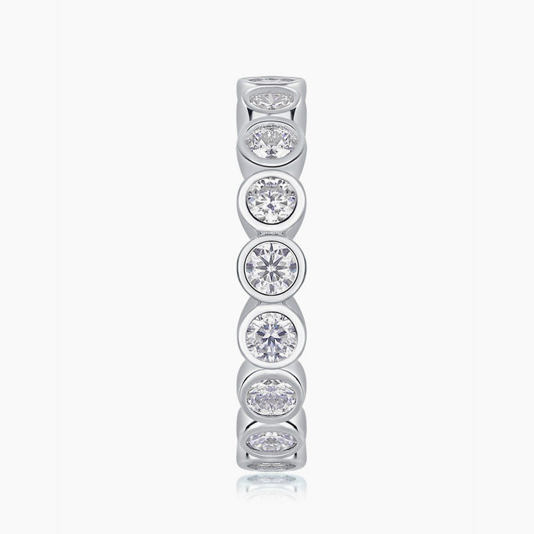 Side profile of bezel eternity moissanite ring in 18K gold plated sterling silver