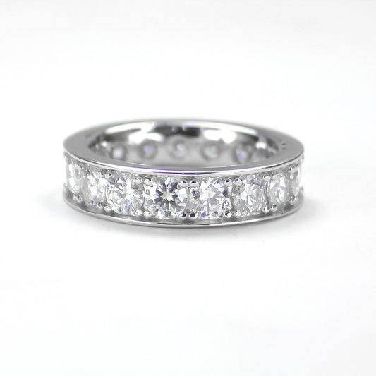 Celeste eternity moissanite band ring in 18K gold plated sterling silver, front view on white background