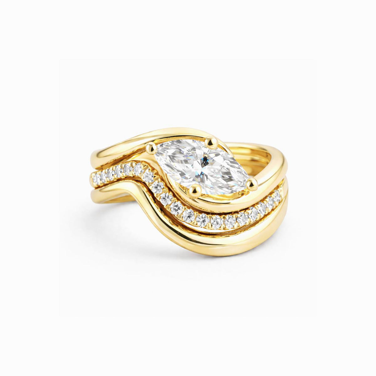 Curved moissanite stackable ring set in 18K gold plated sterling silver on white background