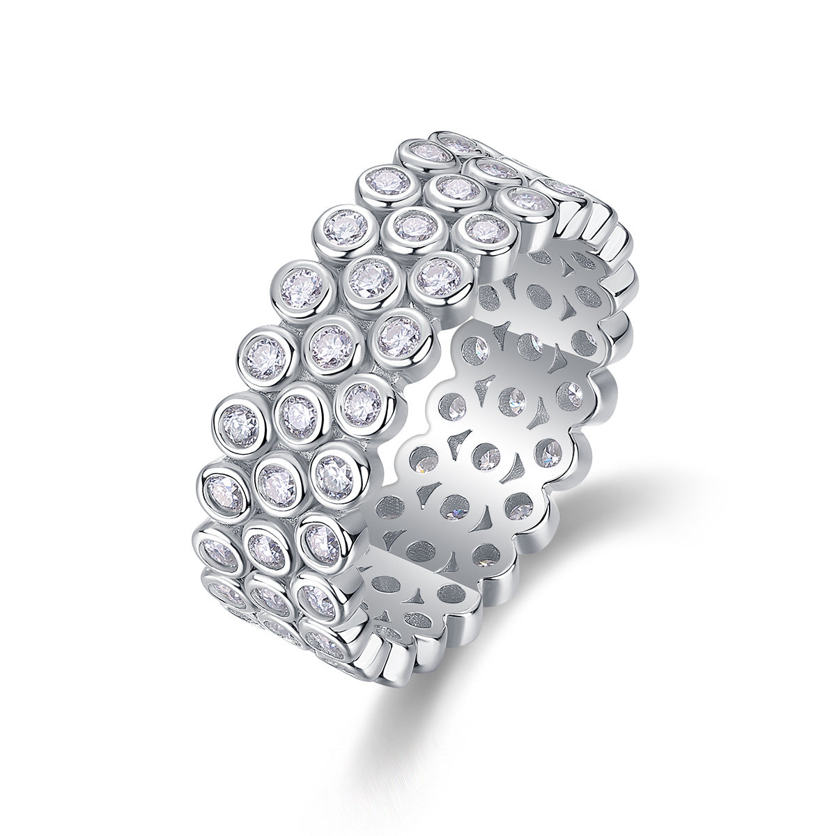 Angled side view of dome pavé moissanite ring standing vertically on white background