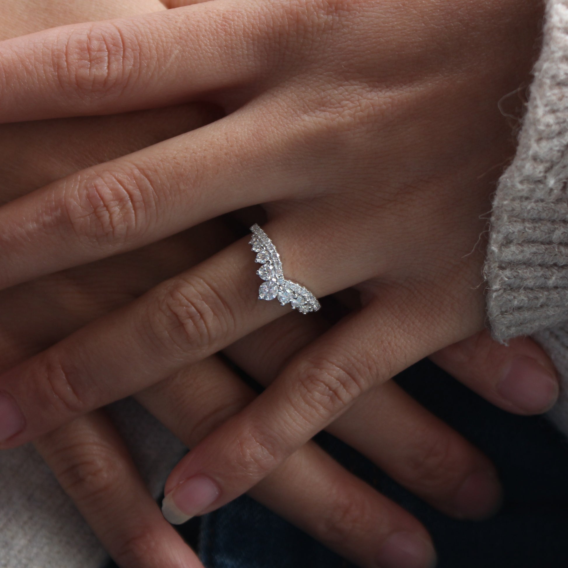Double row moissanite curved band worn on finger