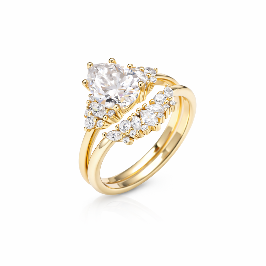 Gold tone duo pear-cut moissanite ring set in 18K gold plated sterling silver on white background