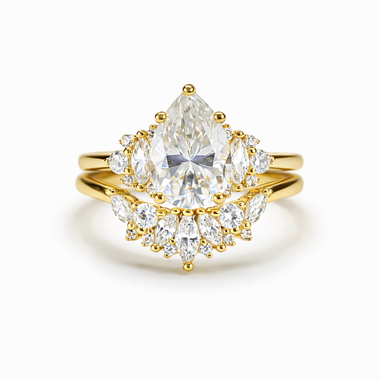 Front view of duo pear-cut moissanite ring set in 18K gold plated sterling silver on clean white background