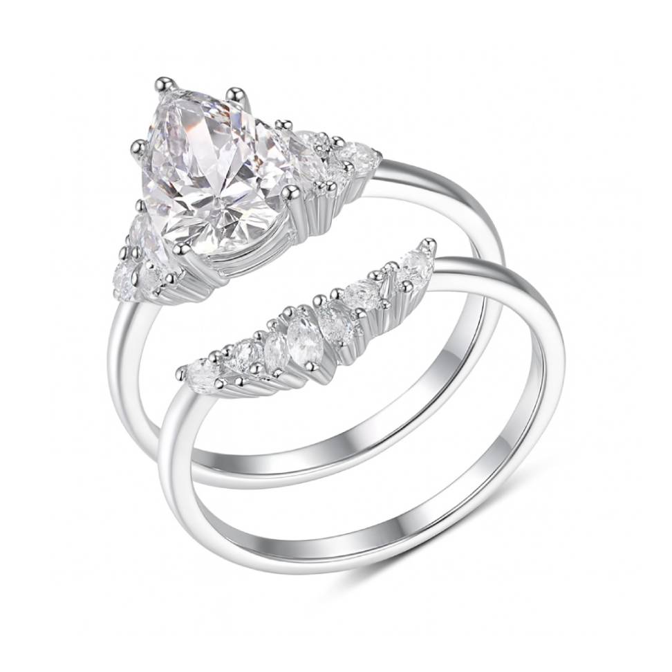White gold tone duo pear-cut moissanite ring set on clean white background