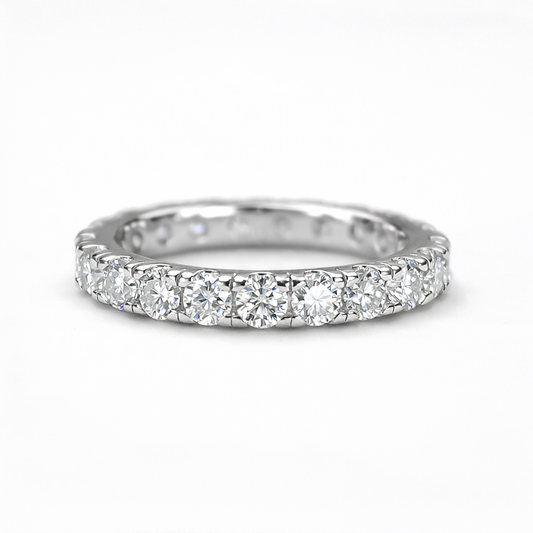 Flat front view of Elara moissanite eternity band ring in 18K gold plated sterling silver on clean white background