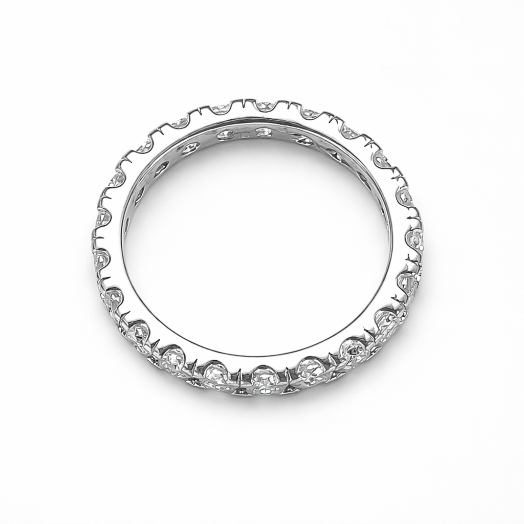 Top-down view of Elara moissanite eternity band ring on clean white background