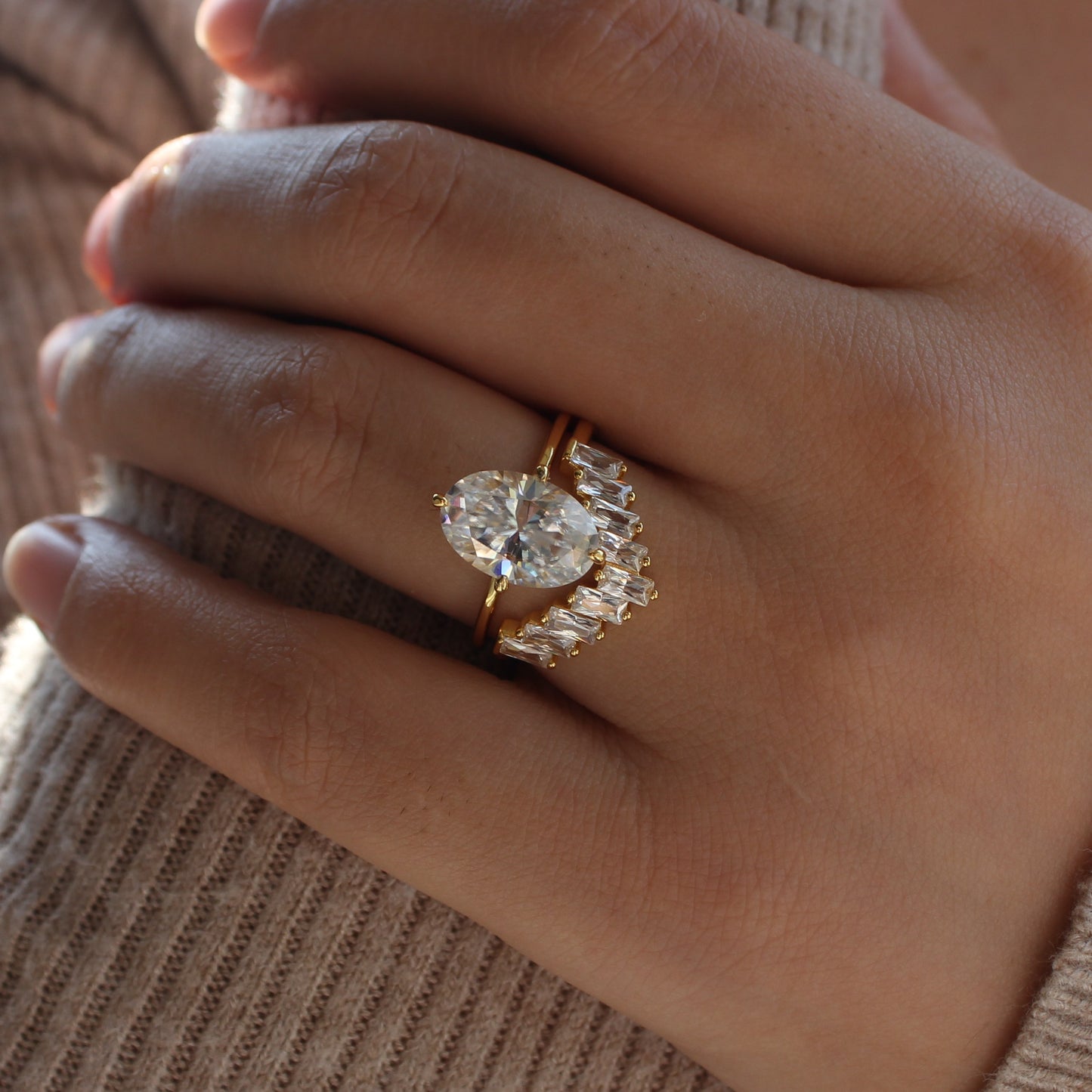 Moissanite cluster ring worn on finger, close-up view