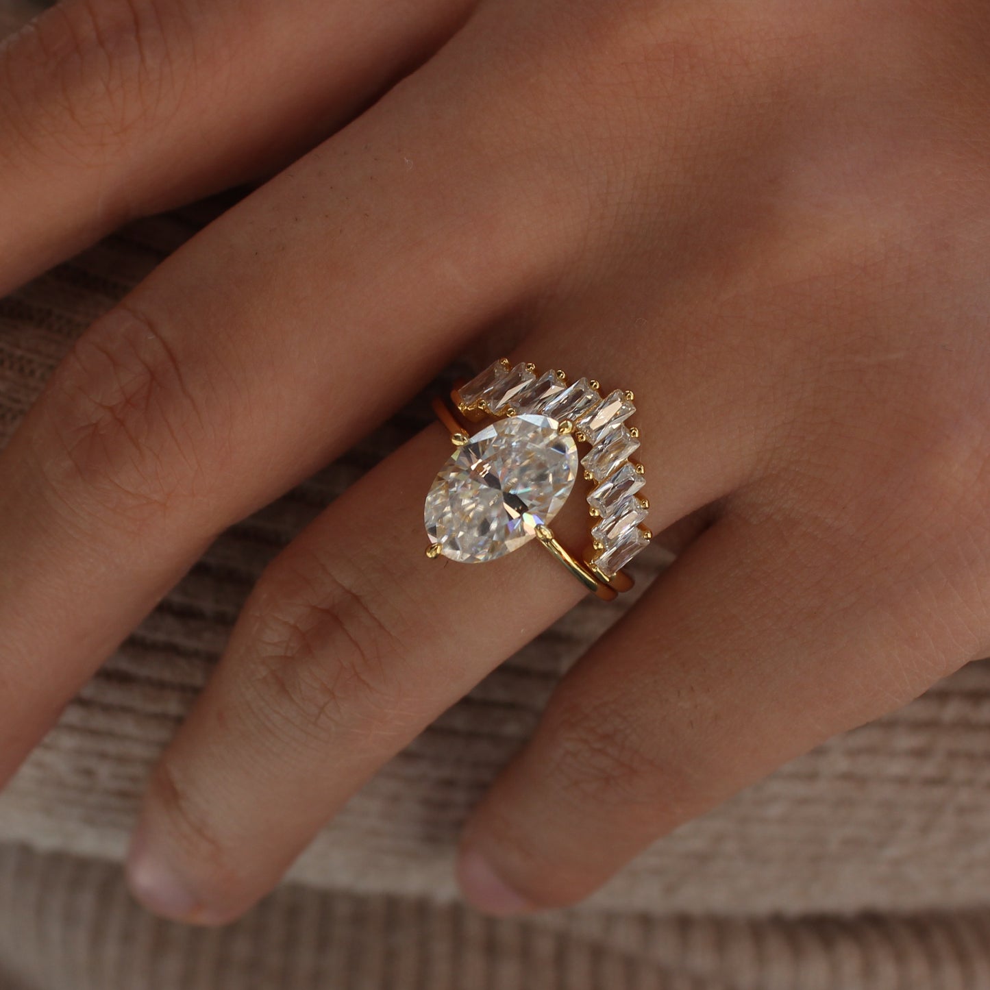 Geometric cluster moissanite ring worn on hand, natural light