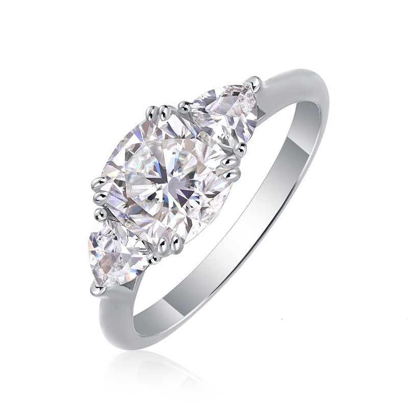 Angled view of guardian cushion moissanite ring on white background