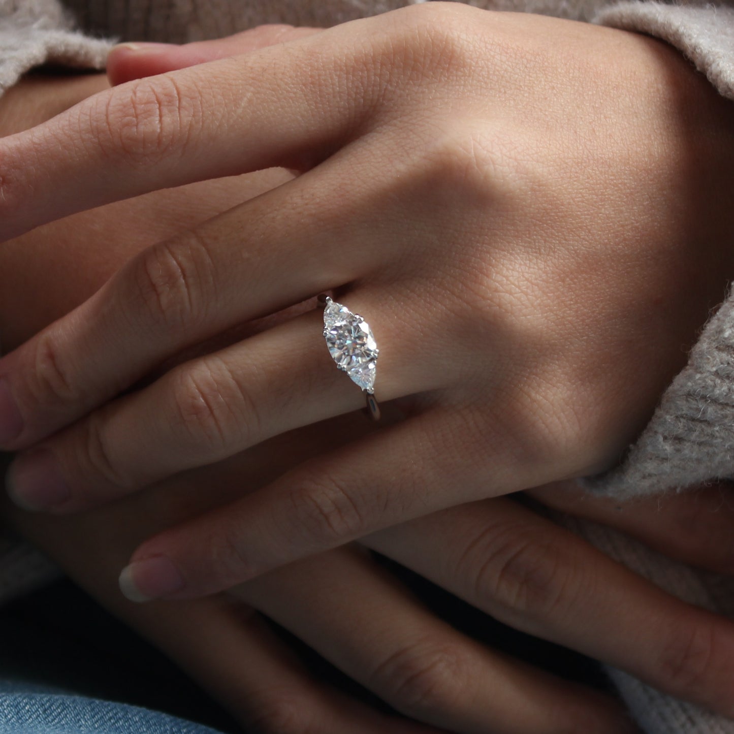 Guardian cushion moissanite ring styled on hand