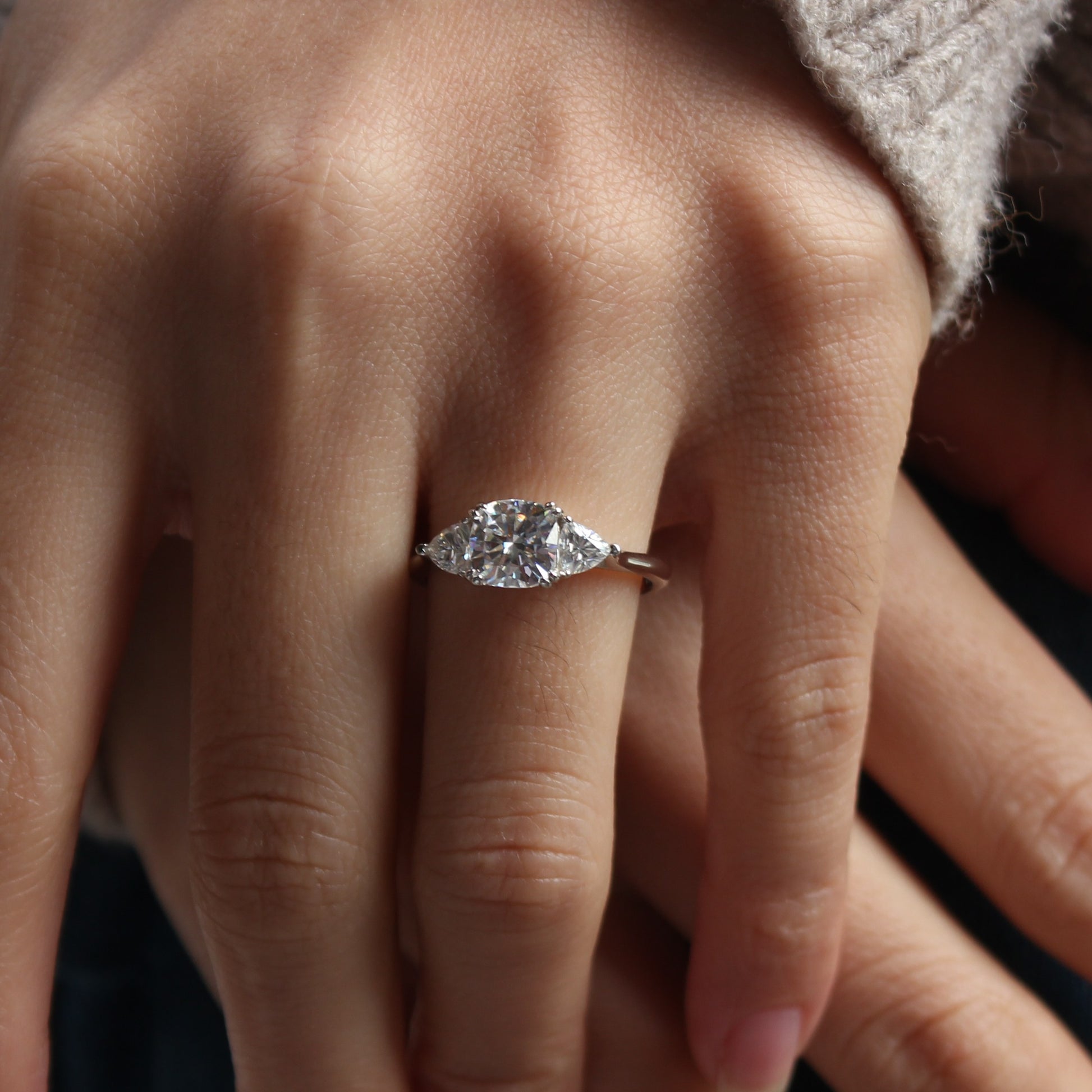 Guardian cushion moissanite ring displayed on hand