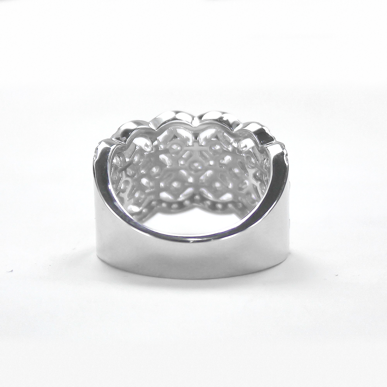 Back view of Lattice pavé moissanite band ring lying flat on white background