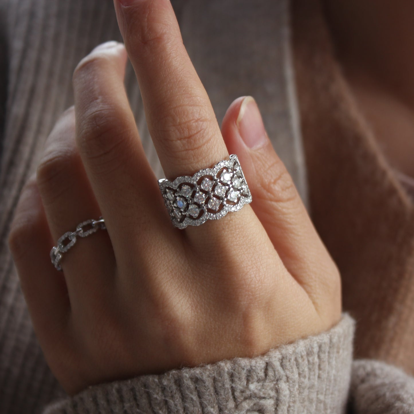 Modern styling of Lattice statement band ring worn on finger