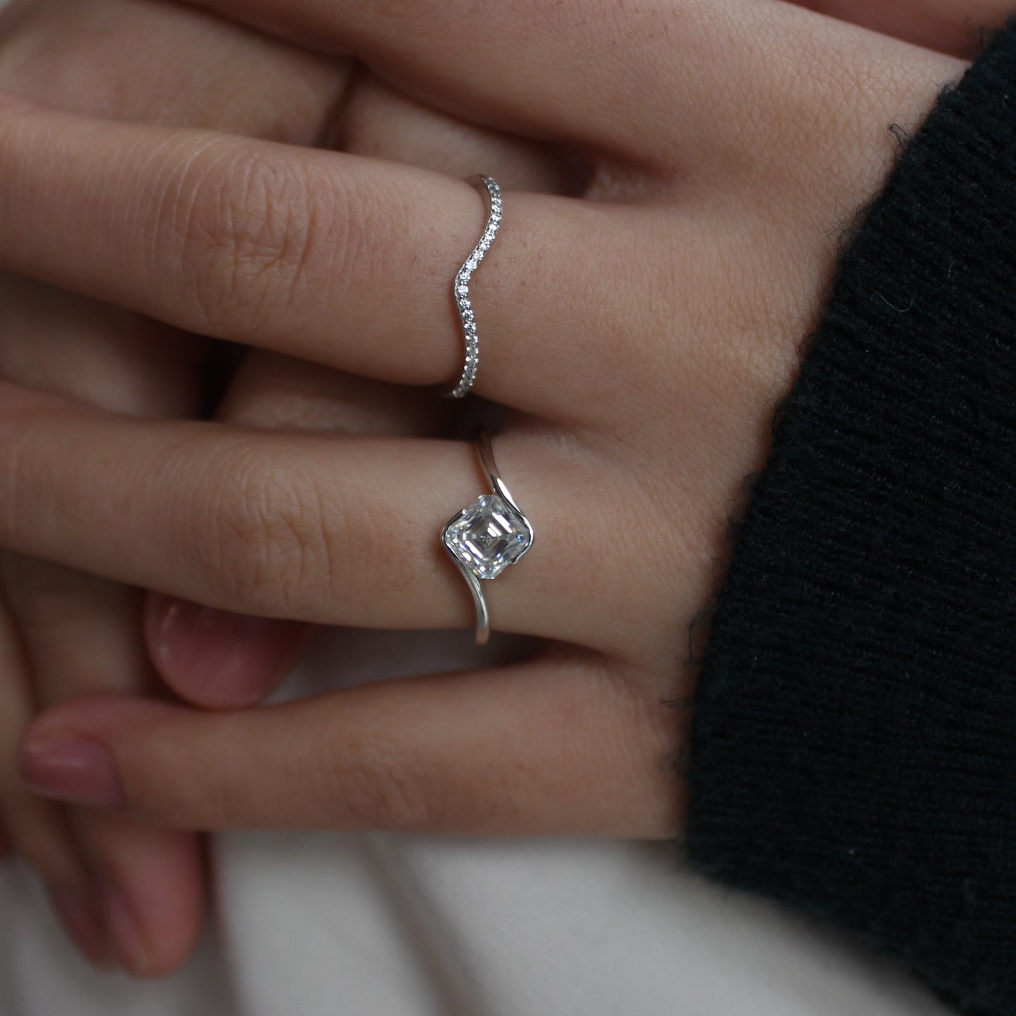 Liora moissanite ring set styled on hand, stacked look