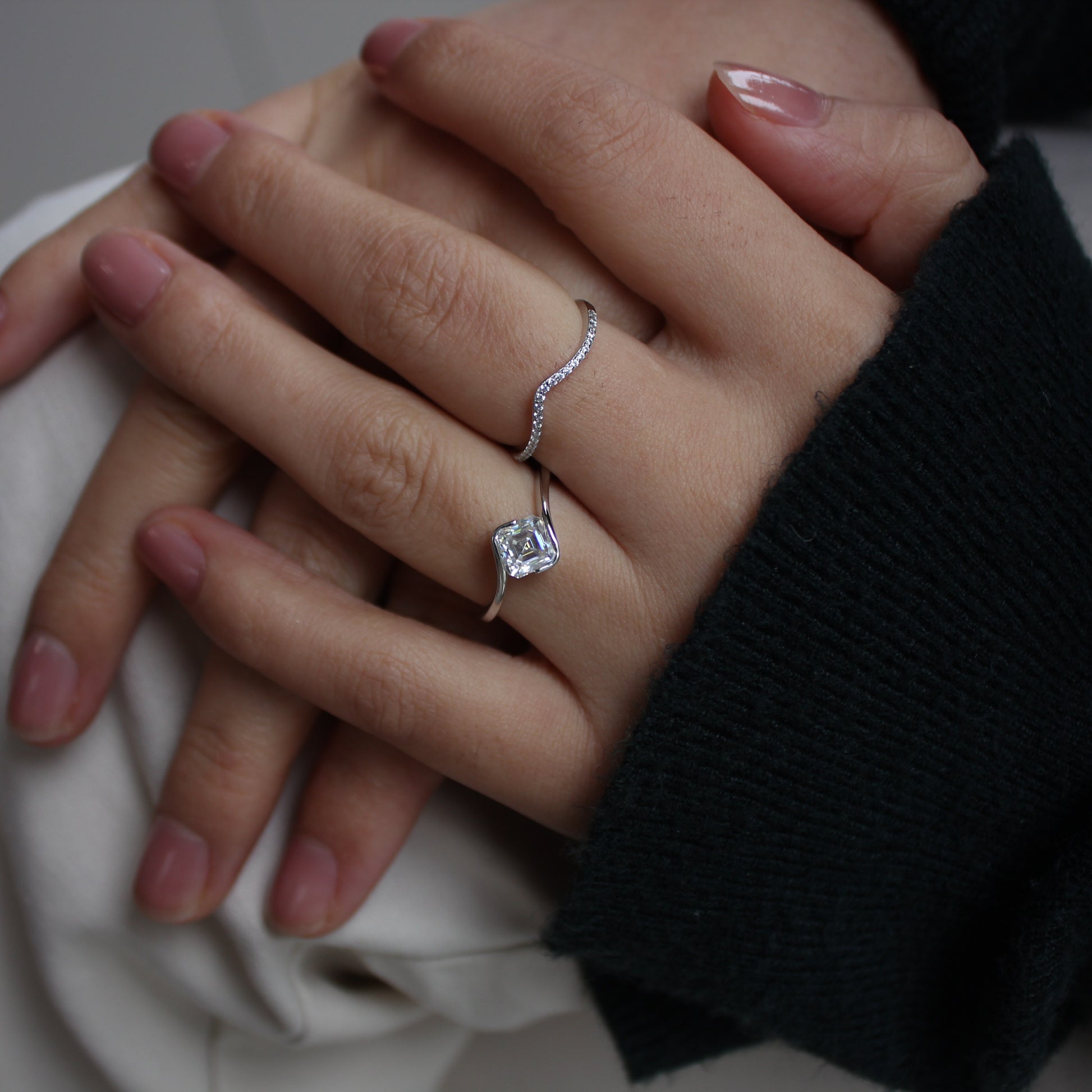 Moissanite duo ring set close-up on hand, silver tone