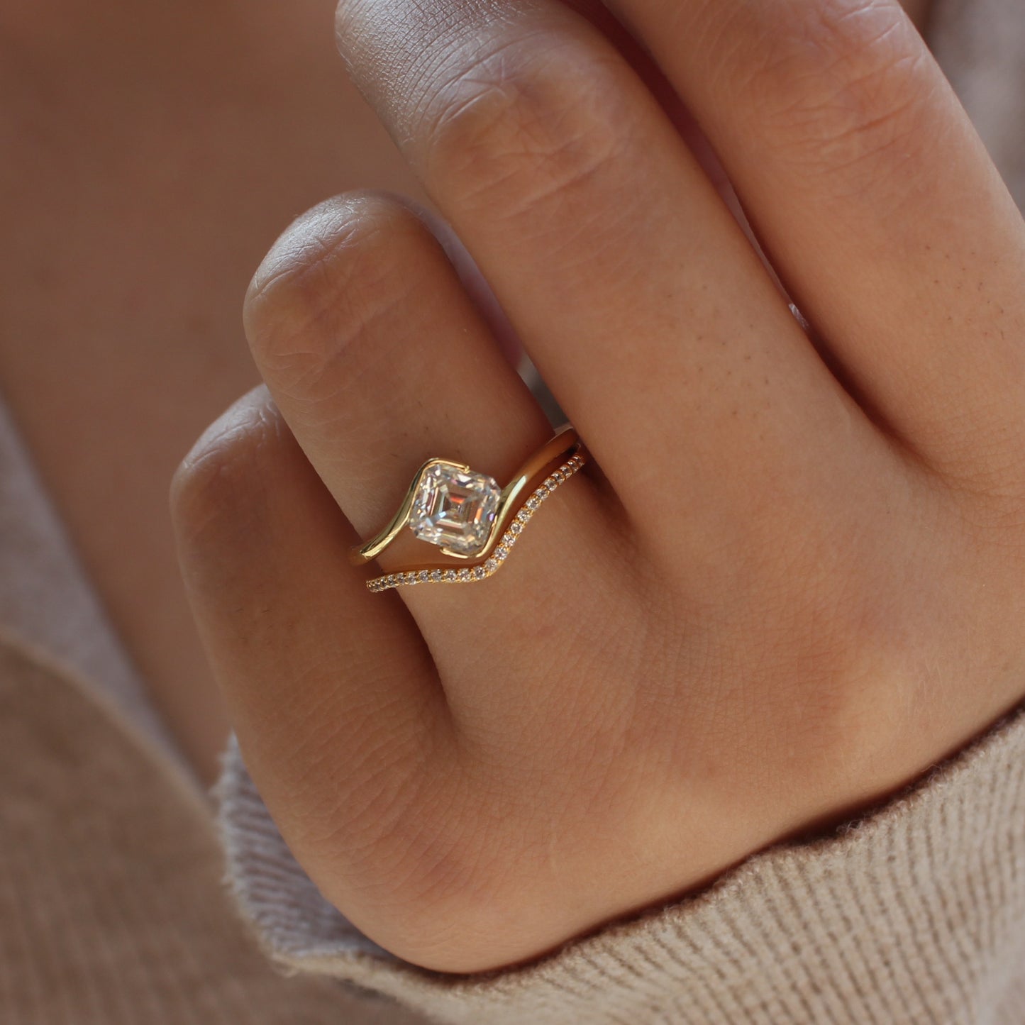 Duo moissanite ring set worn on finger, close-up