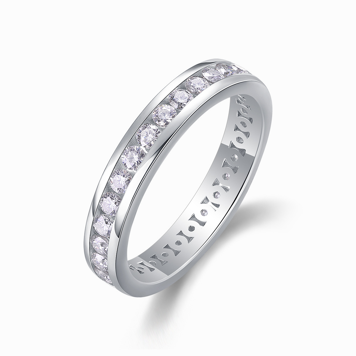 Angled side view of Liora moissanite band ring standing vertically on white background