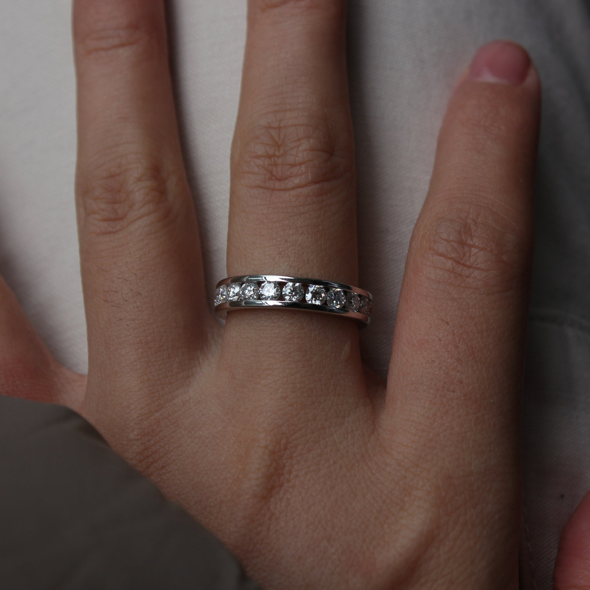 Lifestyle hand photo featuring Liora moissanite band ring
