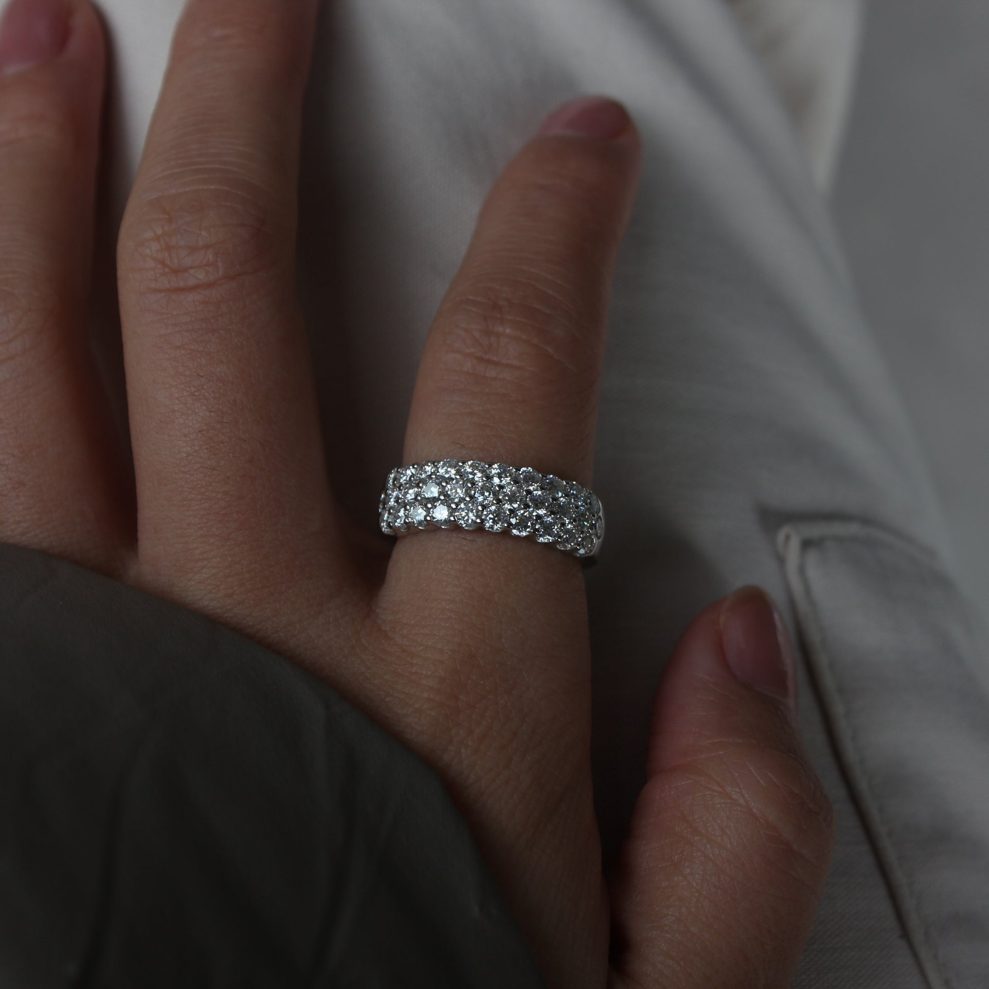 Luna wide moissanite band ring styled on hand, white gold tone statement look