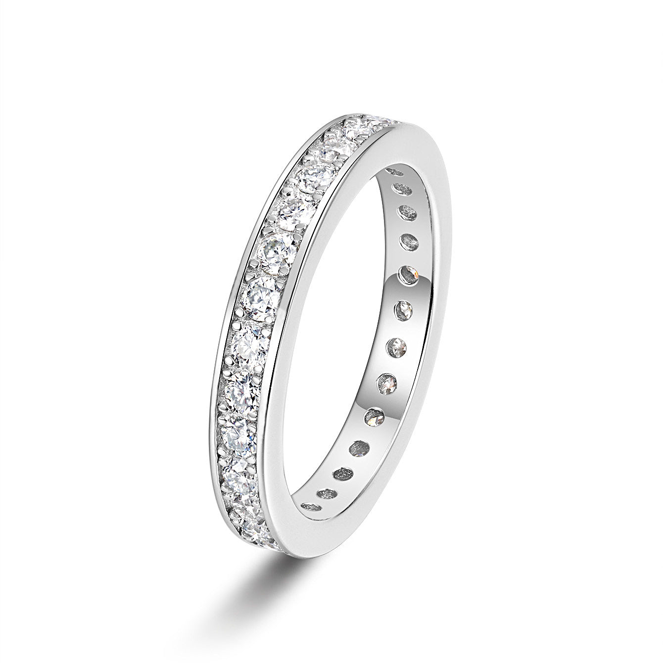 Angled view of moissanite eternity band in silver tone