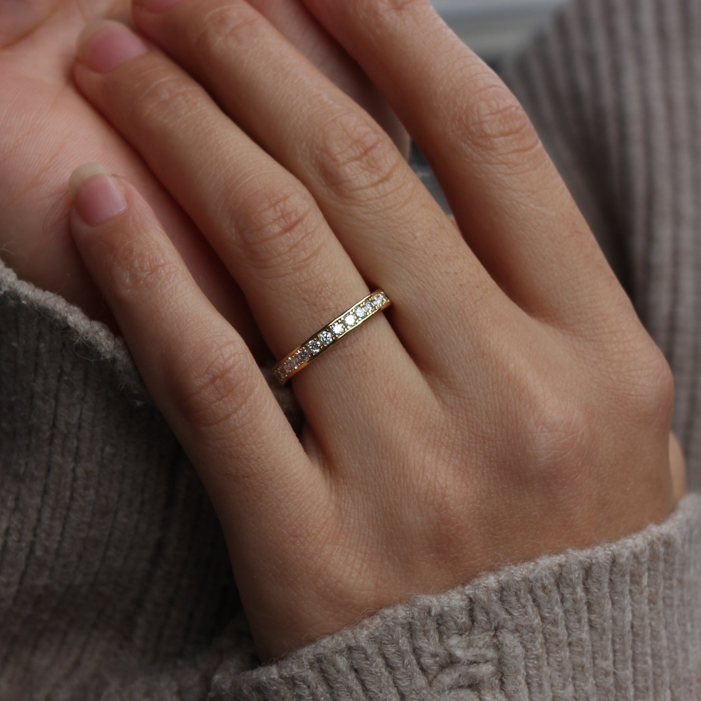Moissanite eternity band styled on hand
