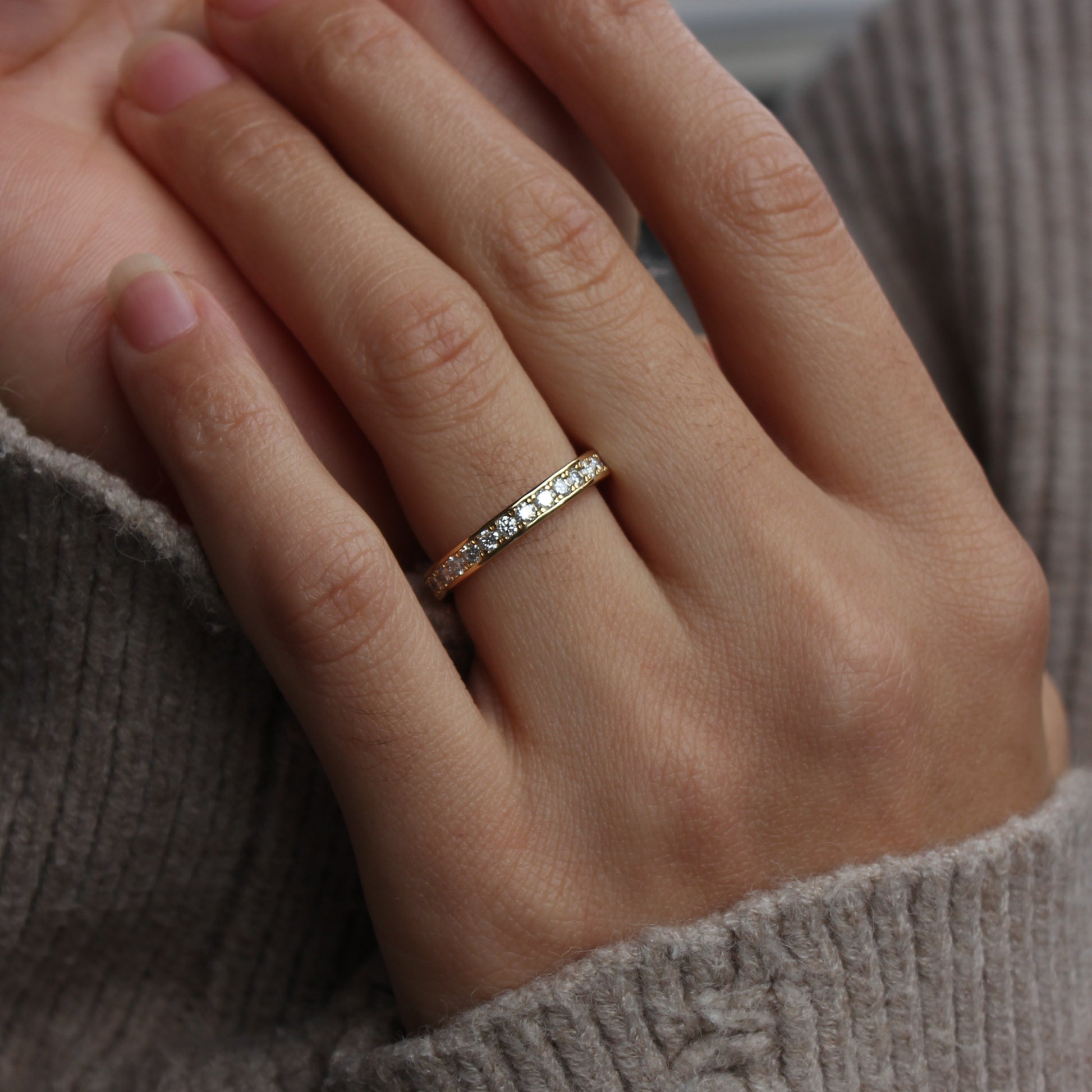 Moissanite eternity band styled on hand