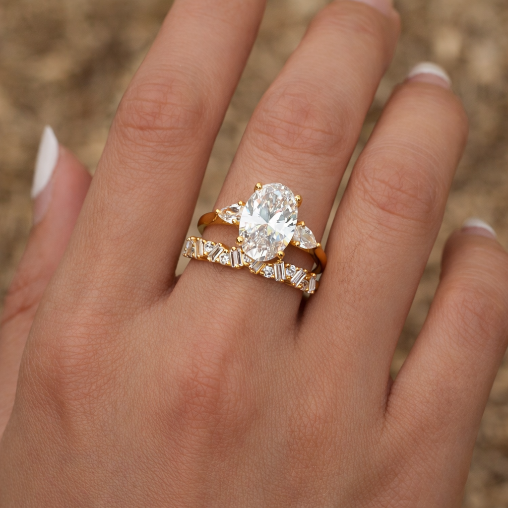 Oval moissanite ring set styled on hand, casual outfit